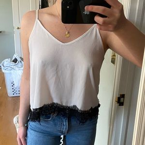 Sheer white tank with black trim
